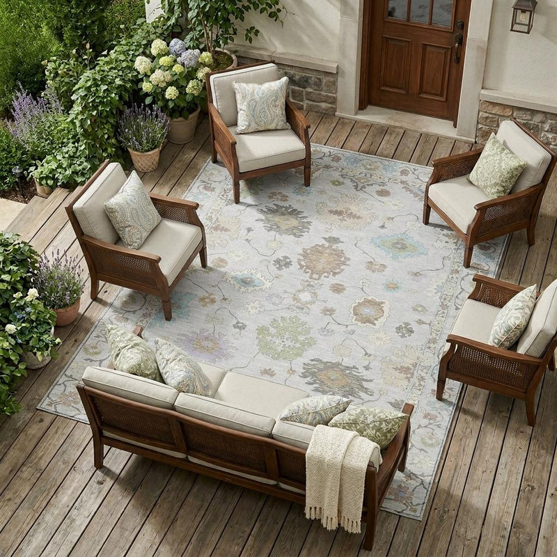Light gray oriental area rug with multicolor floral and vine medallion pattern