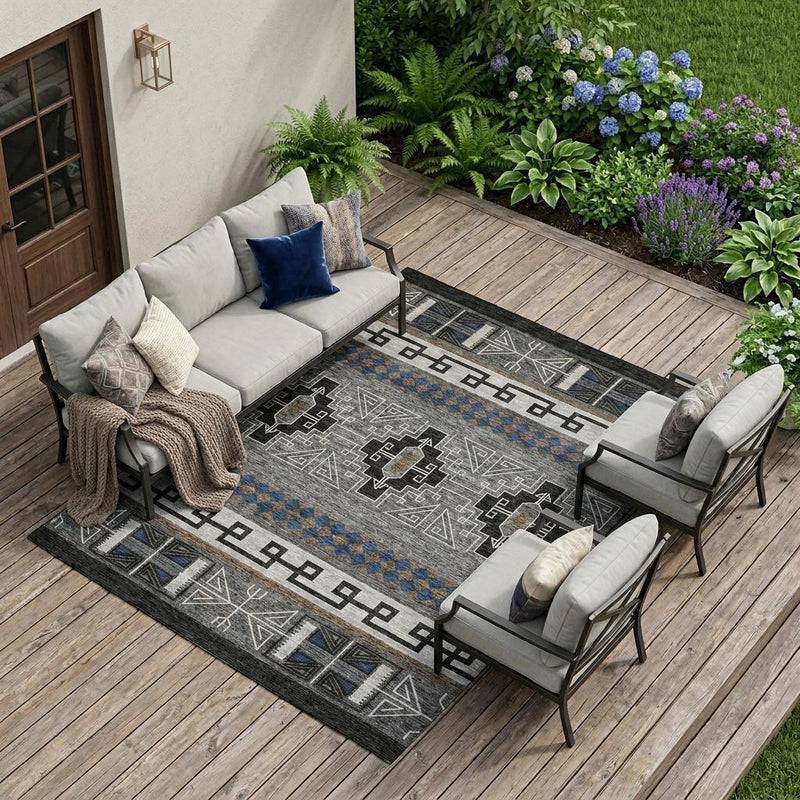 Rectangular tribal area rug with black border, blue stripe bands, and geometric medallions