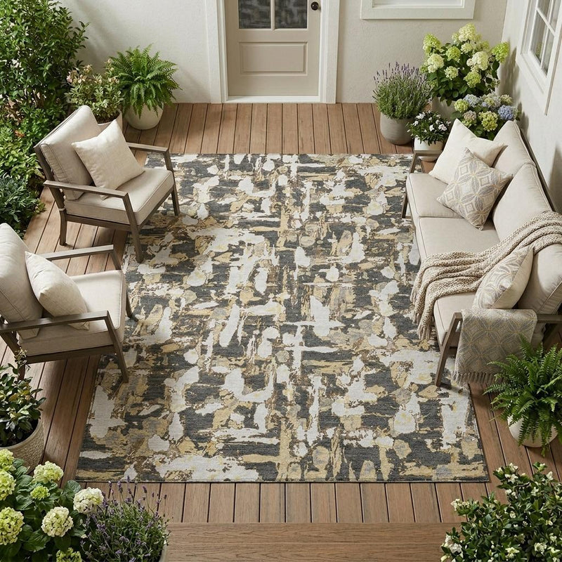 Abstract area rug in a living area with distressed graphite and ivory pattern.