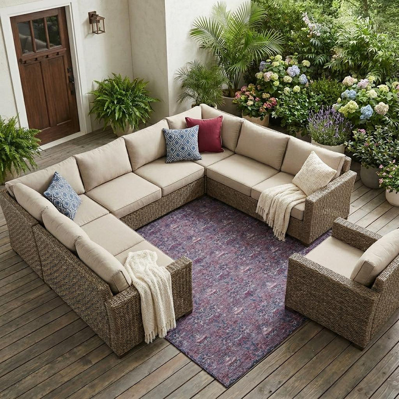 Plum and gray indoor outdoor area rug with ornate floral medallion pattern.
