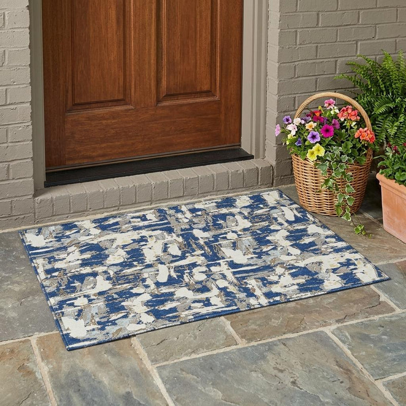 Navy and beige abstract area rug with distressed pattern and border edge