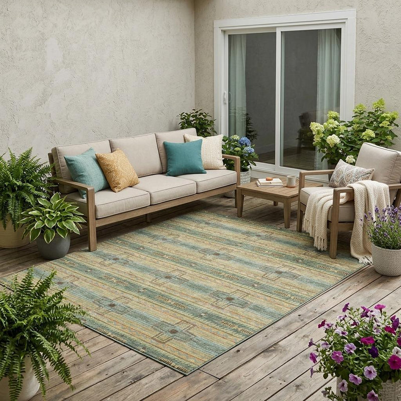Turquoise and green tribal patterned area rug with geometric bands and medallion details