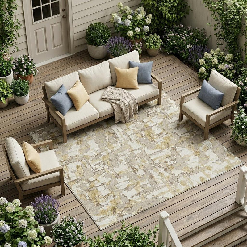 Ivory and beige abstract indoor outdoor area rug with distressed brush pattern