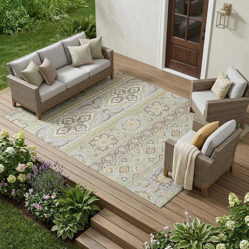 Green and ivory tribal area rug on a wooden patio with outdoor seating