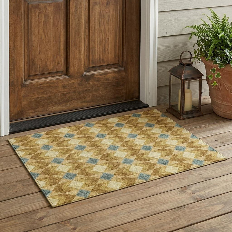 Indoor outdoor area rug with geometric diamond pattern in tan and teal