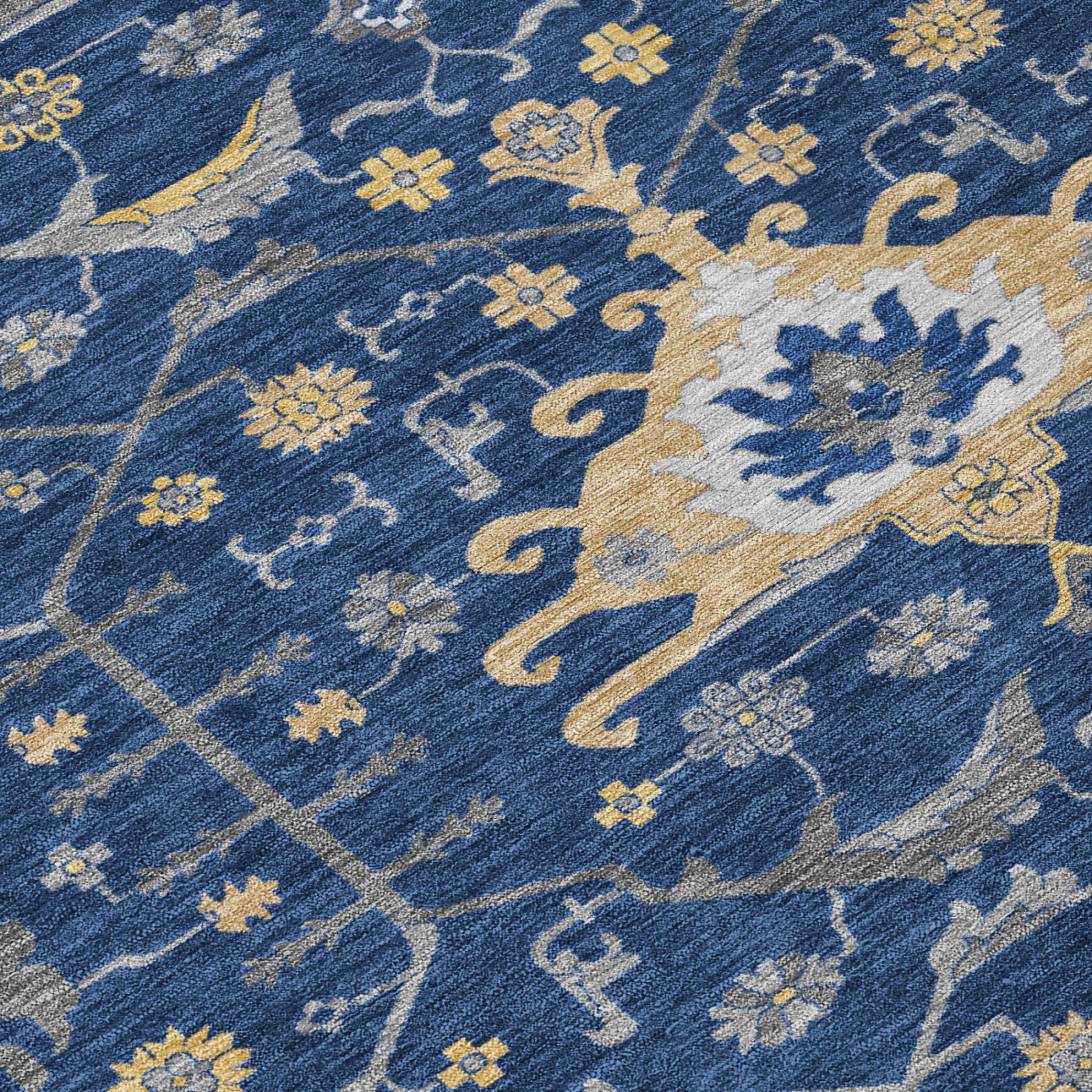 Navy blue area rug with yellow and gray floral patterns, featuring a traditional design and soft, durable material.