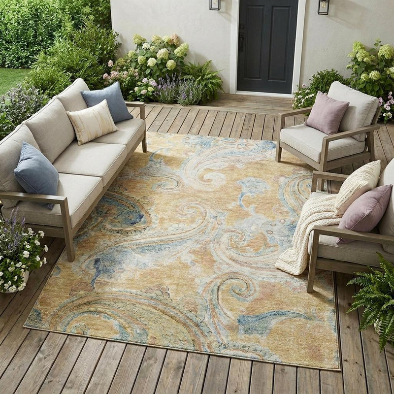 Indoor outdoor area rug with beige base and light blue ornate paisley design