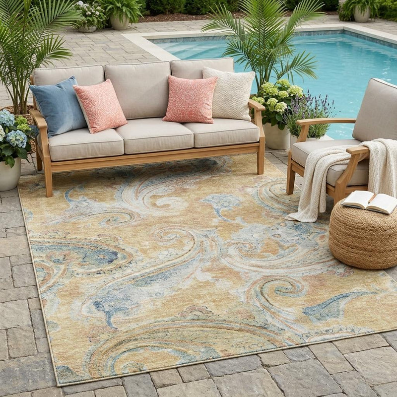 Tan and blue paisley area rug on patio flooring beneath outdoor seating