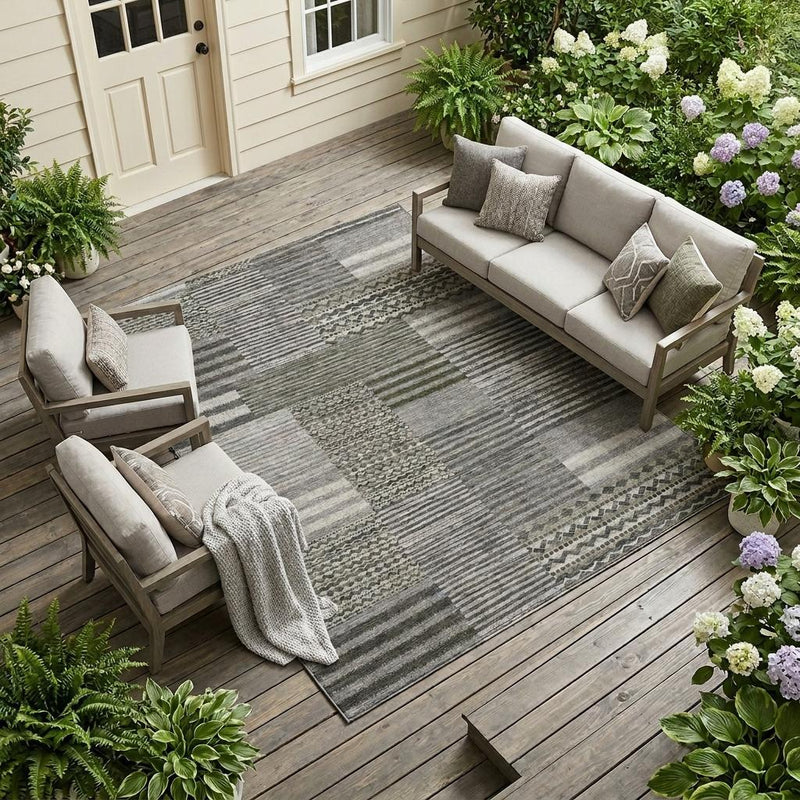 Pewter-gray striped patchwork area rug with geometric border pattern