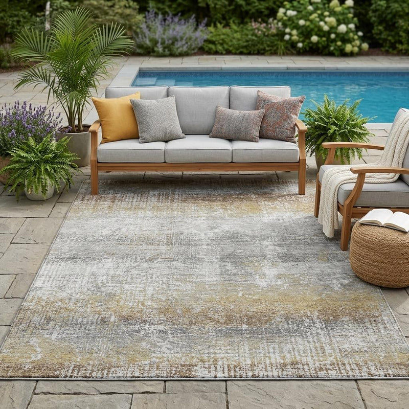 Gray and khaki abstract area rug with distressed, washed pattern