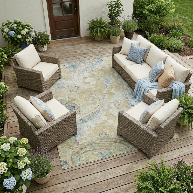 Wheat and blue paisley outdoor area rug on a wooden deck