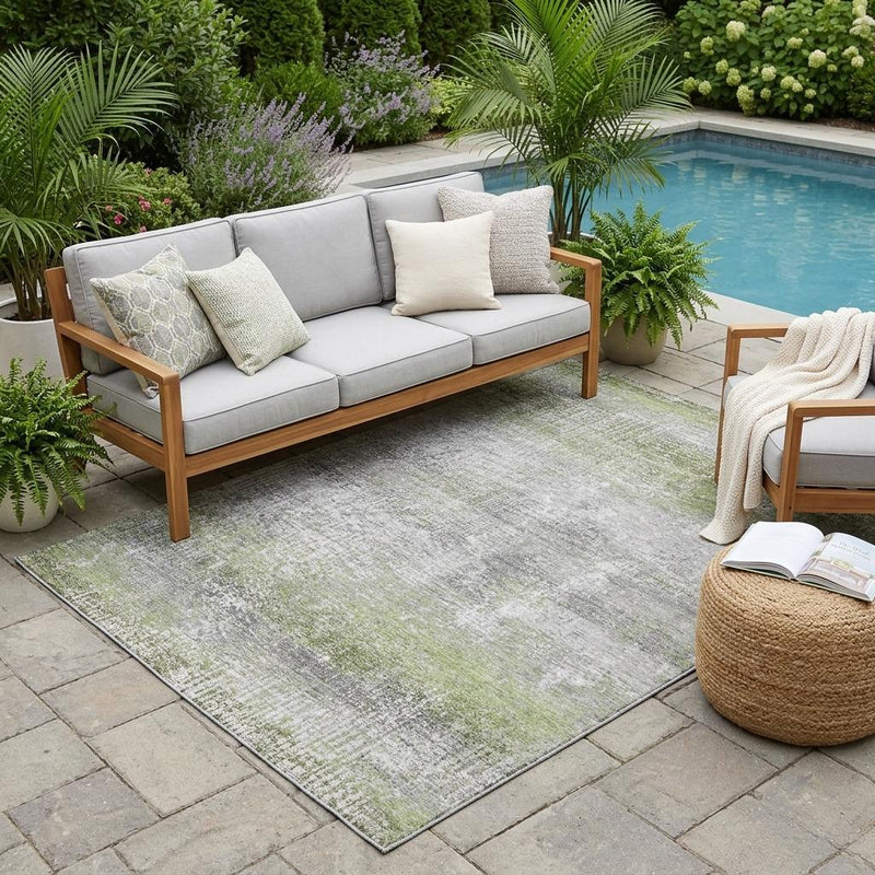 Green and gray abstract area rug with low-pile texture for indoor or outdoor use