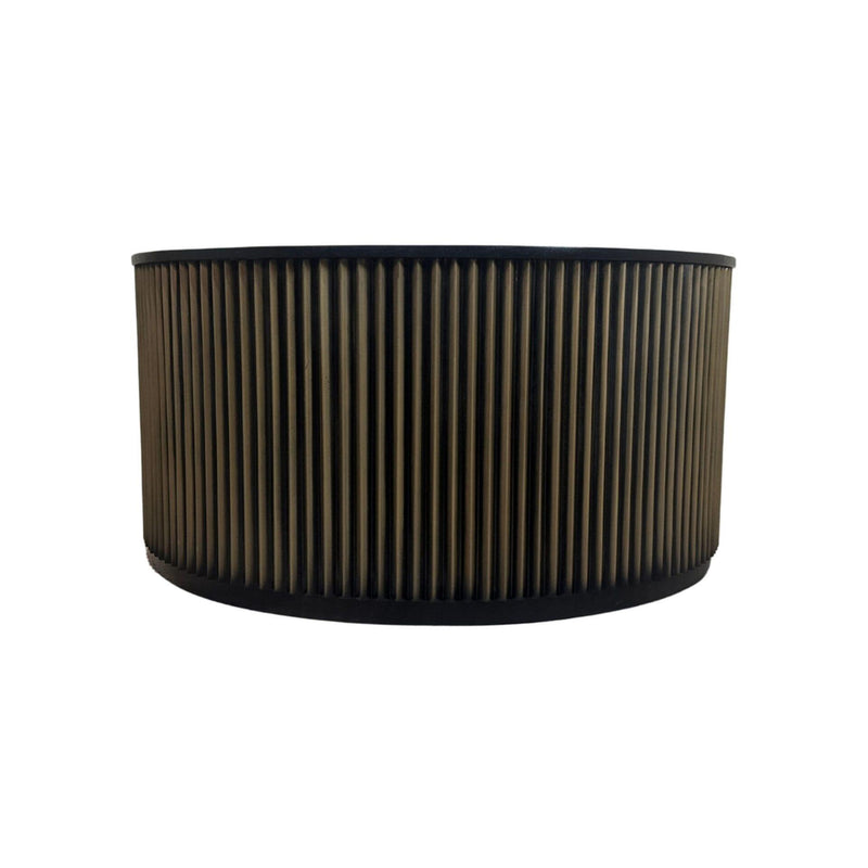 Round drum coffee table, side view: black circular top and vertical ribbed brass-toned body
