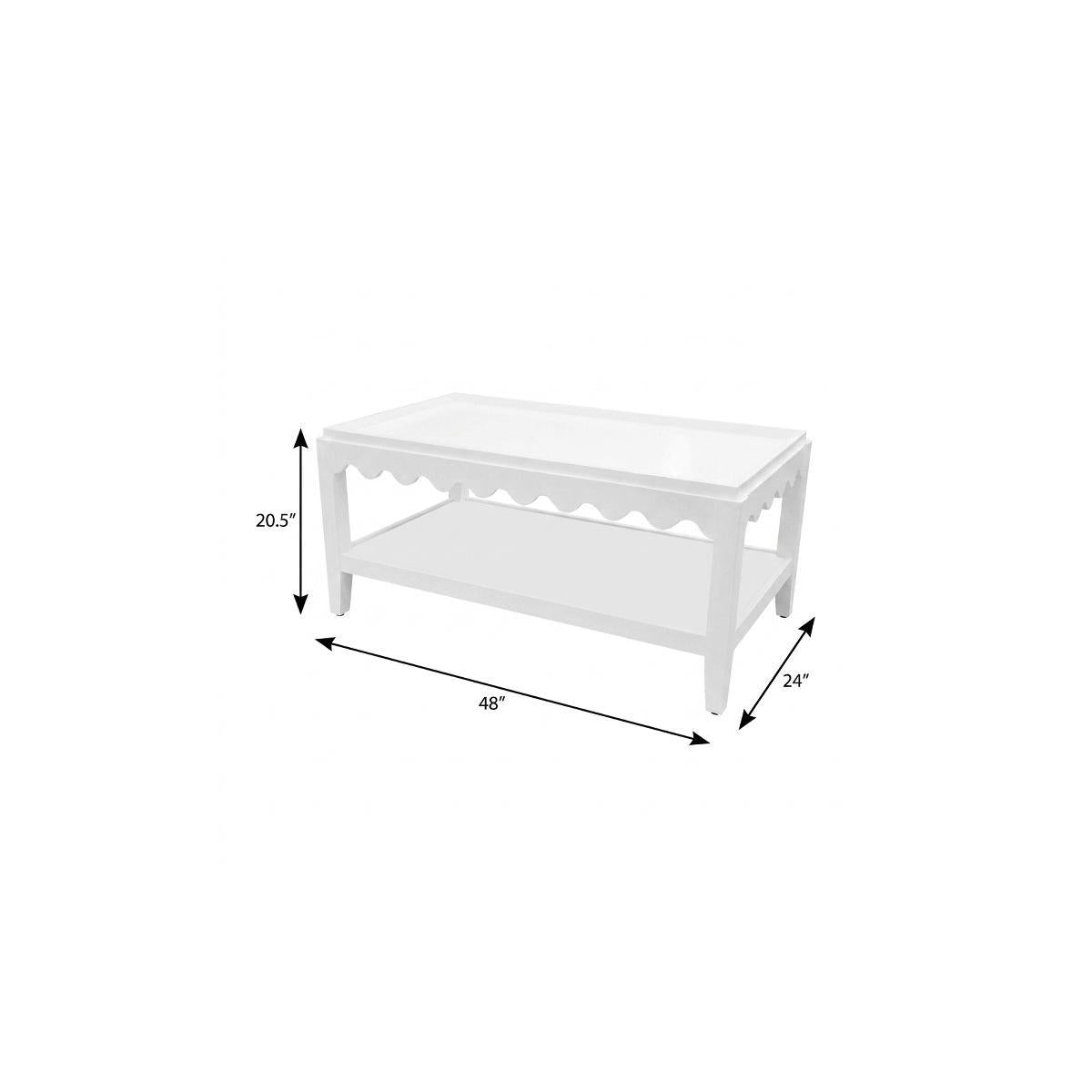 White solid wood coffee table with scalloped apron and two-tier shelf