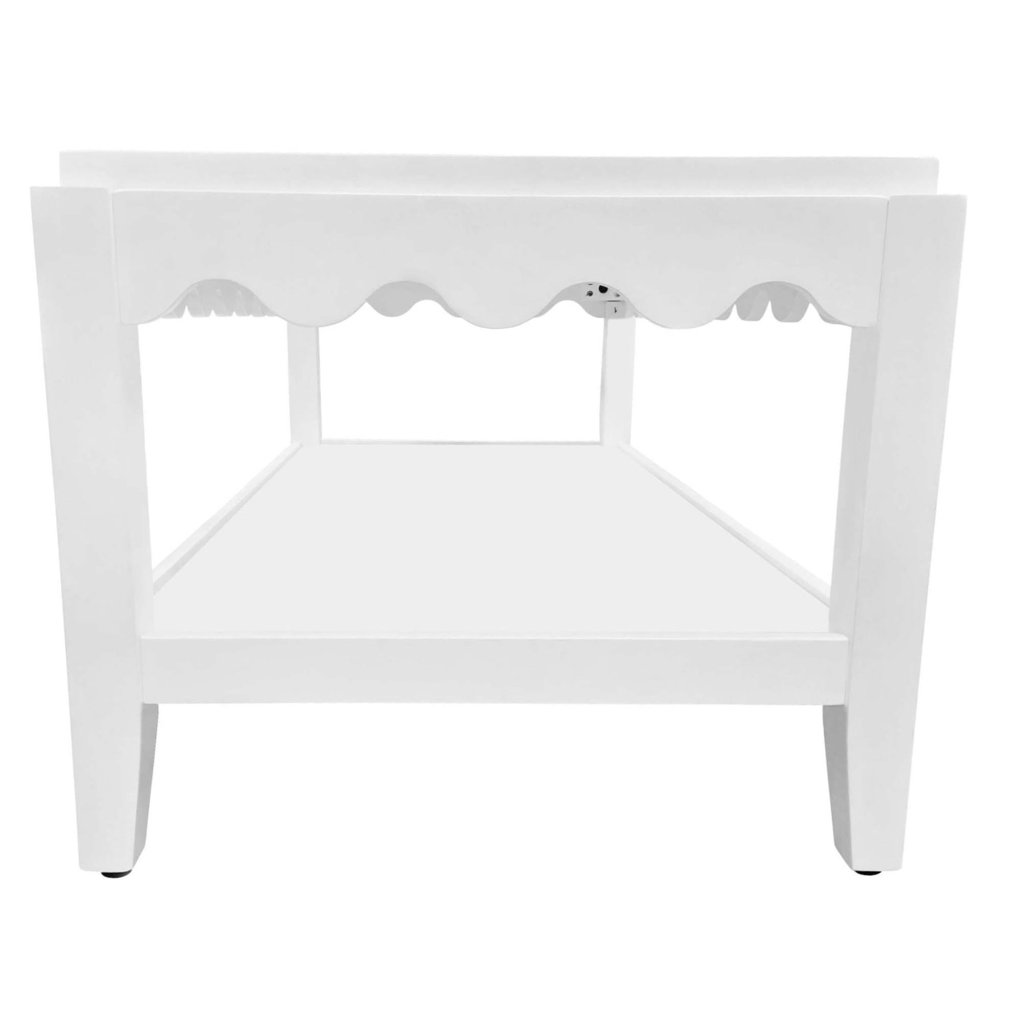 White solid wood coffee table underside view with scalloped apron and open base