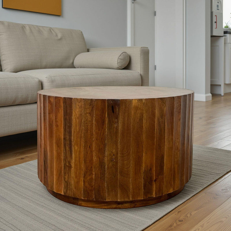 Chestnut round wood coffee table with thick flat top and cylindrical sides