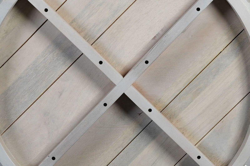 White round wood coffee table underside with crisscross braces and bolt holes