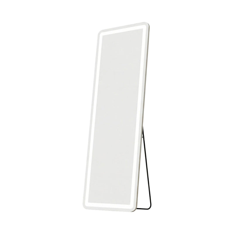 Lighted full-length mirror with white frame, leaning with stand support