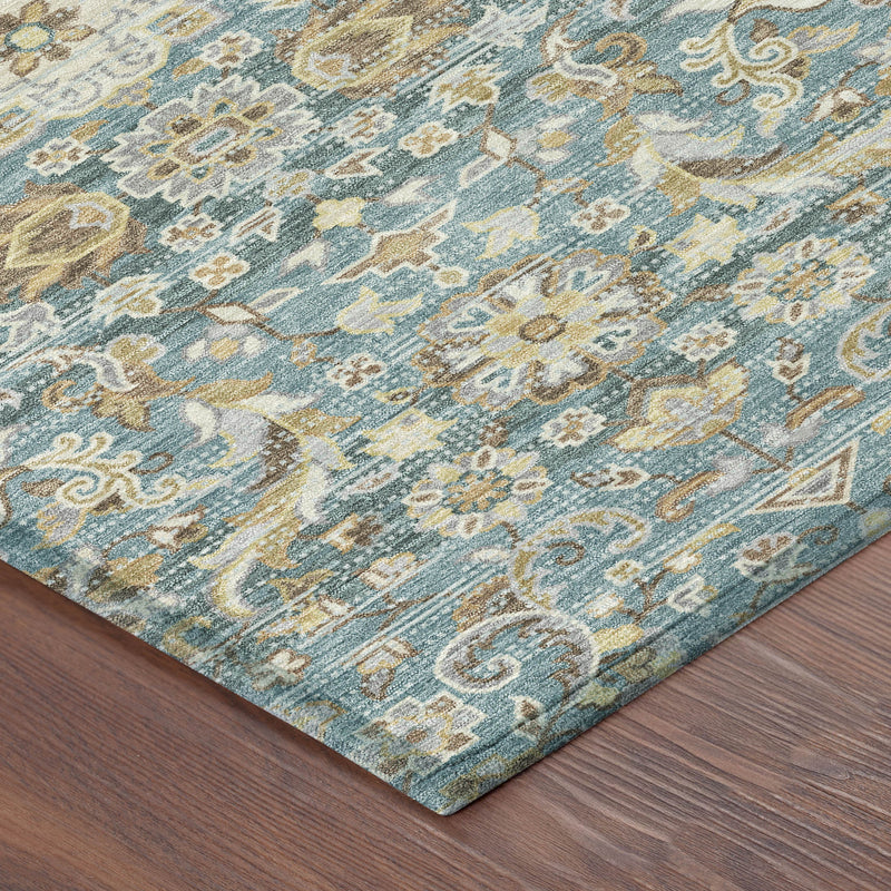 Round area rug in teal blue with beige and brown medallion floral pattern