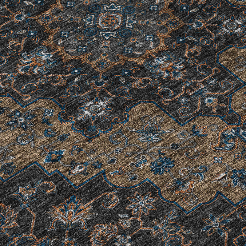 Close-up indoor outdoor rug texture with dark patterning and blue ornamental details