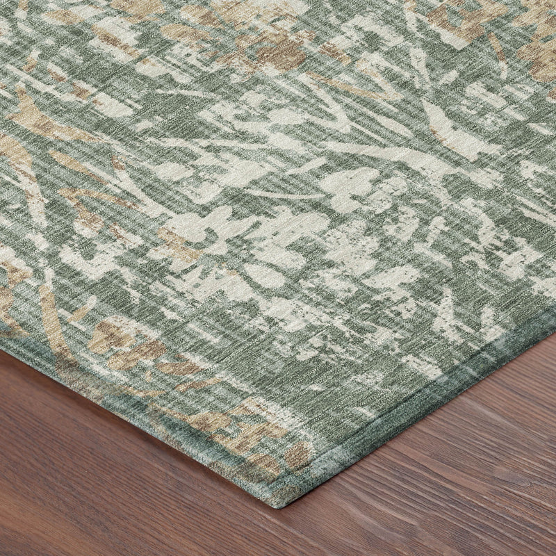 Corner view of round damask area rug in sage green with beige and tan woven pattern