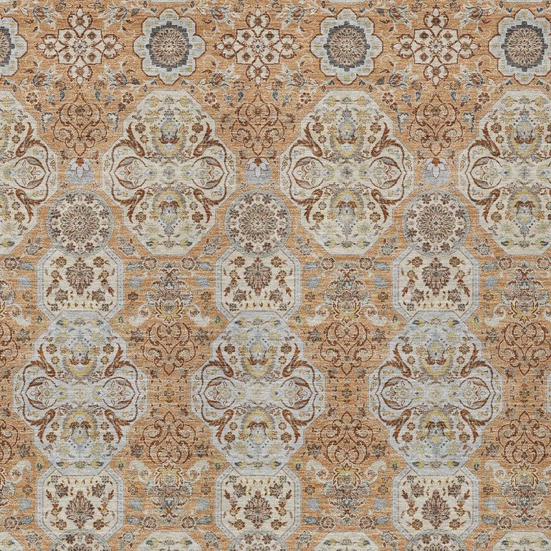 Close-up floral medallion pattern area rug, copper and gold with pale blue-gray details.