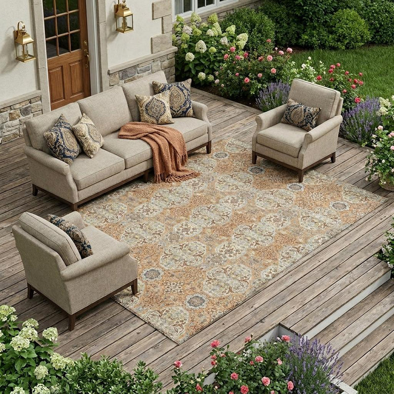 Floral medallion area rug in copper and gold with blue-gray accents on outdoor deck.