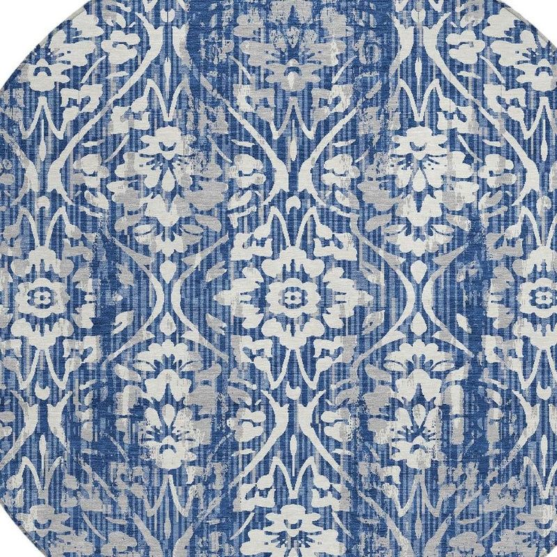 Round rug close-up with blue and white damask motifs