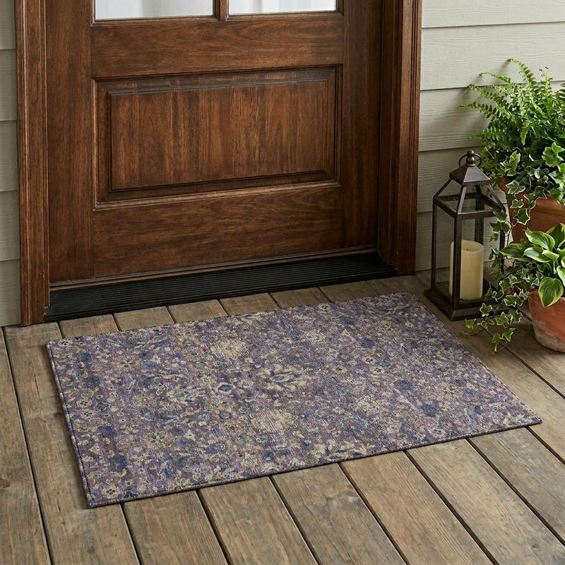 Purple and blue floral medallion area rug on wood deck flooring, rectangular.