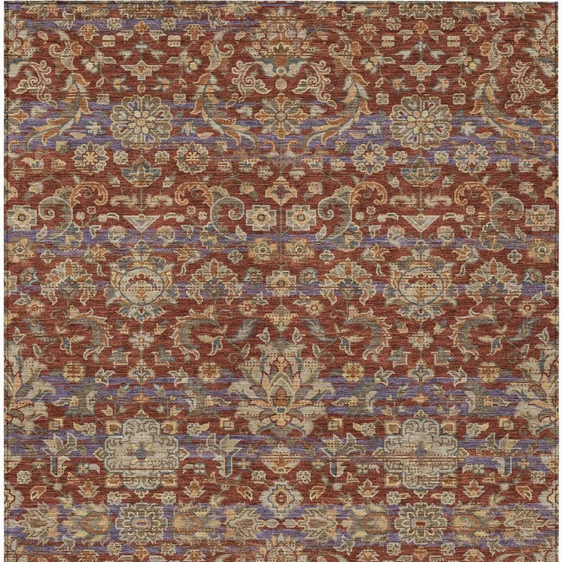 Top view rug with repeating floral scroll motifs in rust, beige, and blue hues