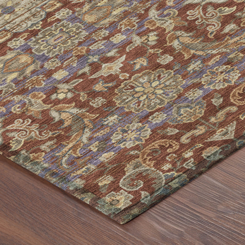 Close-up area rug showing distressed medallion motifs in rust, beige, blue, and teal