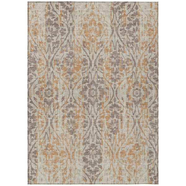 Beige damask area rug with gray and copper-tone ornate pattern