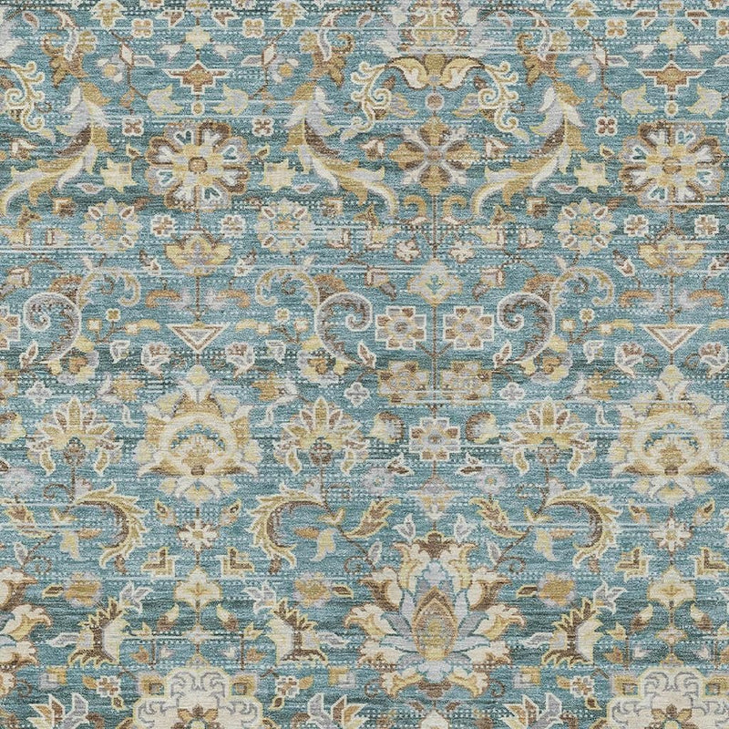 Teal blue washable area rug close-up with white and tan ornate floral medallion details