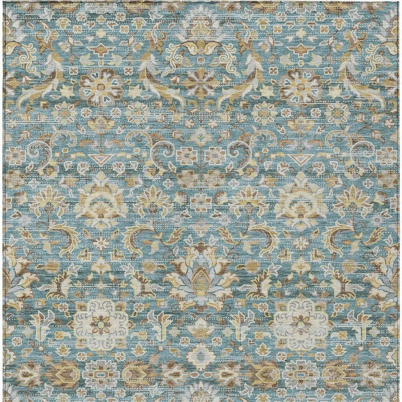 Washable indoor/outdoor area rug in teal blue with repeating floral medallion motifs