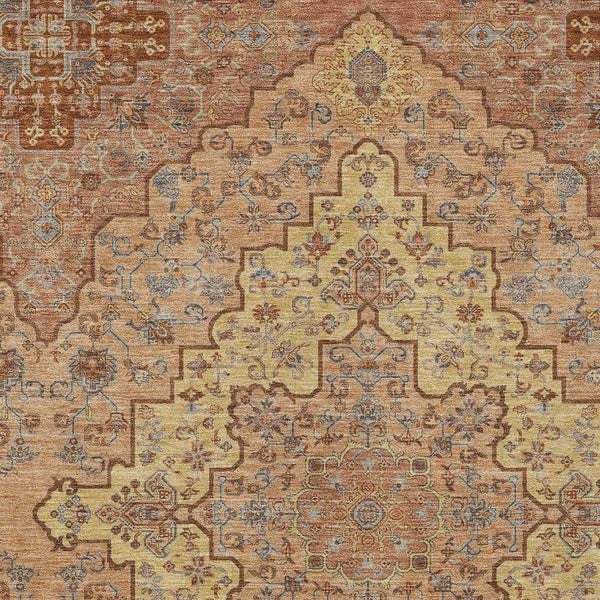 Washable area rug with copper, gold, and blue medallion-style ornamental pattern.