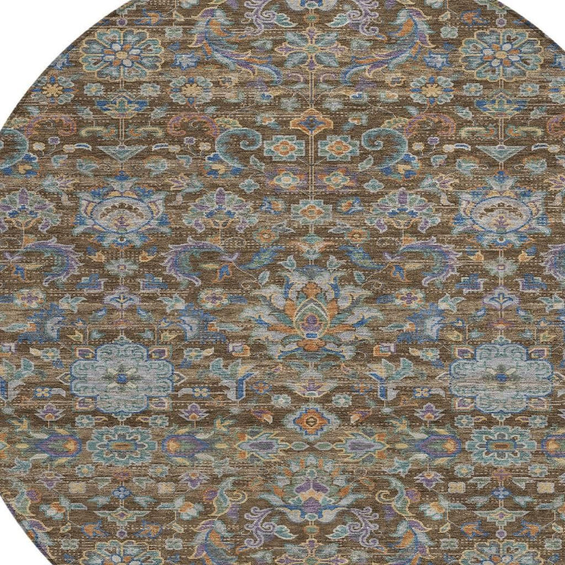Round rug with central medallion and scrolling floral border in brown and blue