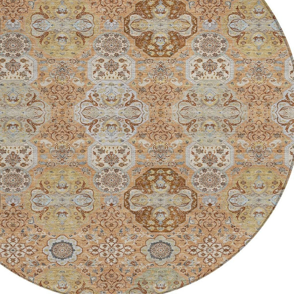 Overhead view of round rug pattern with ornate florals in warm tan, copper, and light blue.