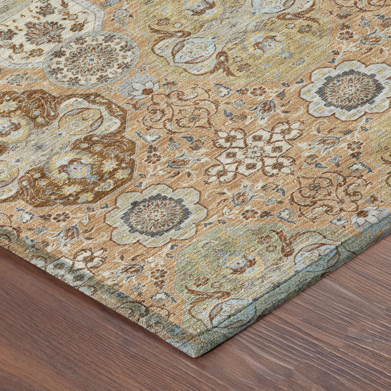 Close-up of round rug surface with vintage floral medallion pattern and blue-green accents.