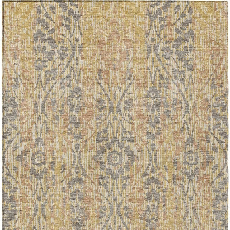 Gold and gray damask area rug with repeating floral and vine motifs