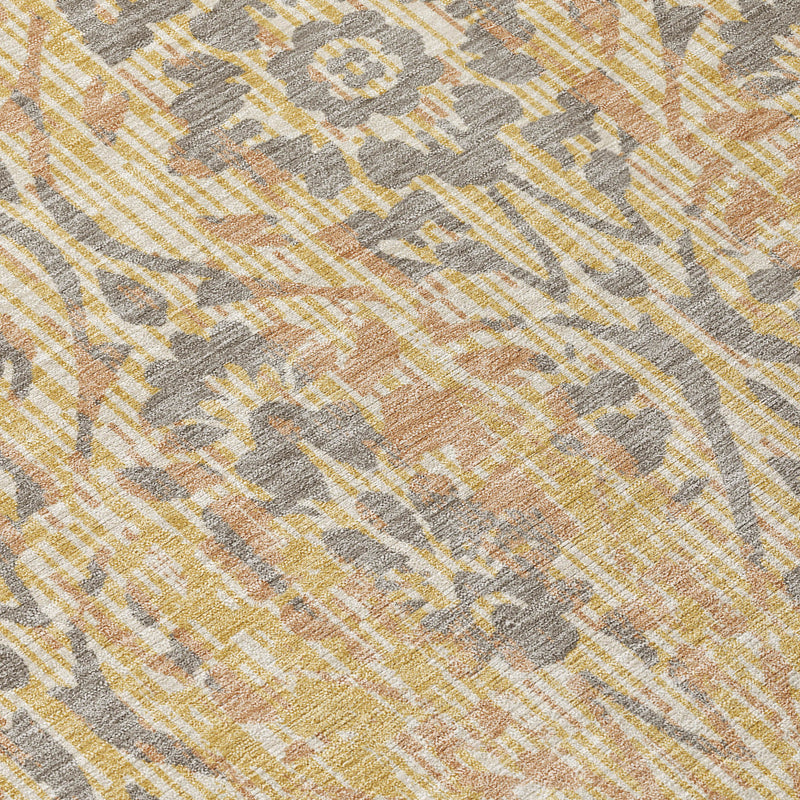 Gold and gray damask rug surface with distressed woven texture