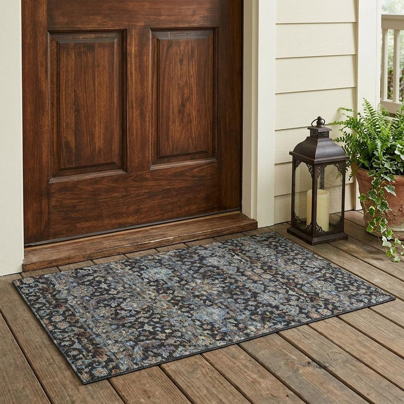 Outdoor area rug with multicolor floral medallion pattern on charcoal ground