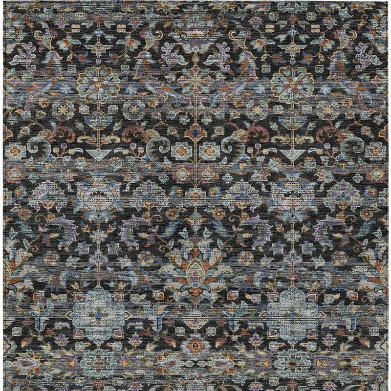 Charcoal area rug with dark background and multicolor ornate geometric motif