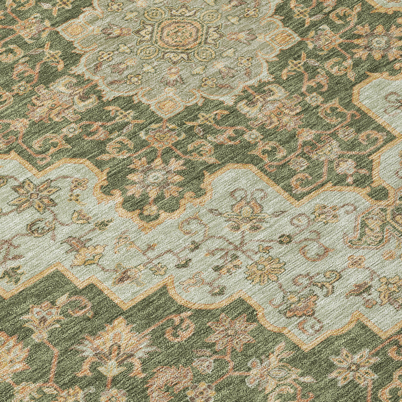 Textured view of green rug featuring gold and beige medallion motifs and corner details