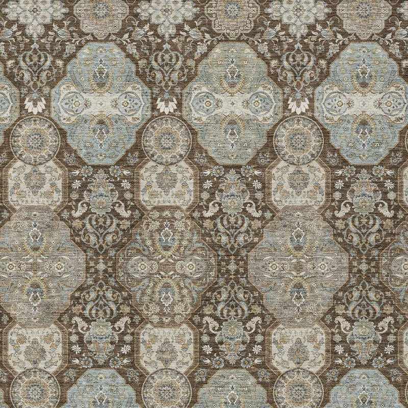 Geometric area rug close-up with blue-gray and taupe octagon medallions and scrollwork