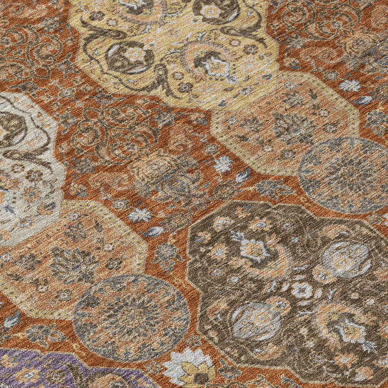 Orange copper floral rug close-up with intricate scrolling motifs and medallion details.