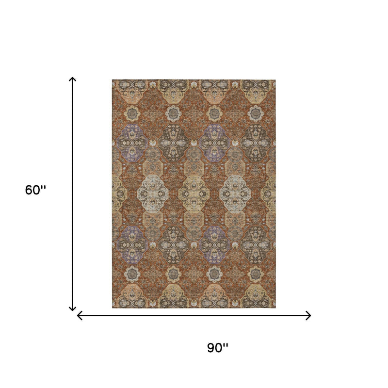 Rectangular orange and copper floral area rug shown with 60 in by 90 in dimensions.