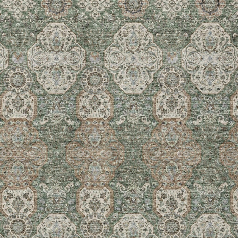 Green area rug with repeating octagon floral medallion pattern in cream and tan