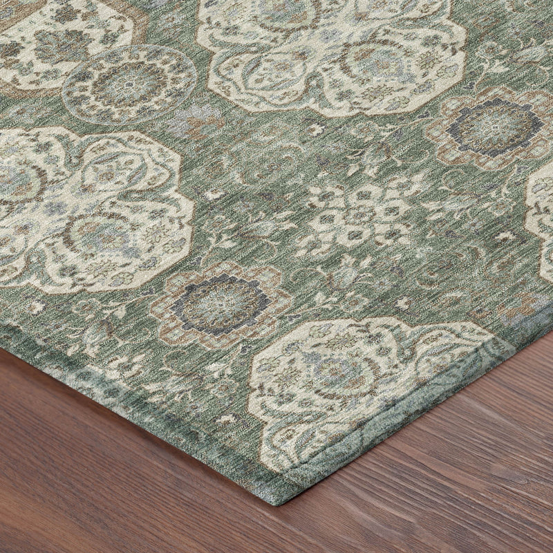 Green area rug with cream and tan floral medallion pattern, textured surface