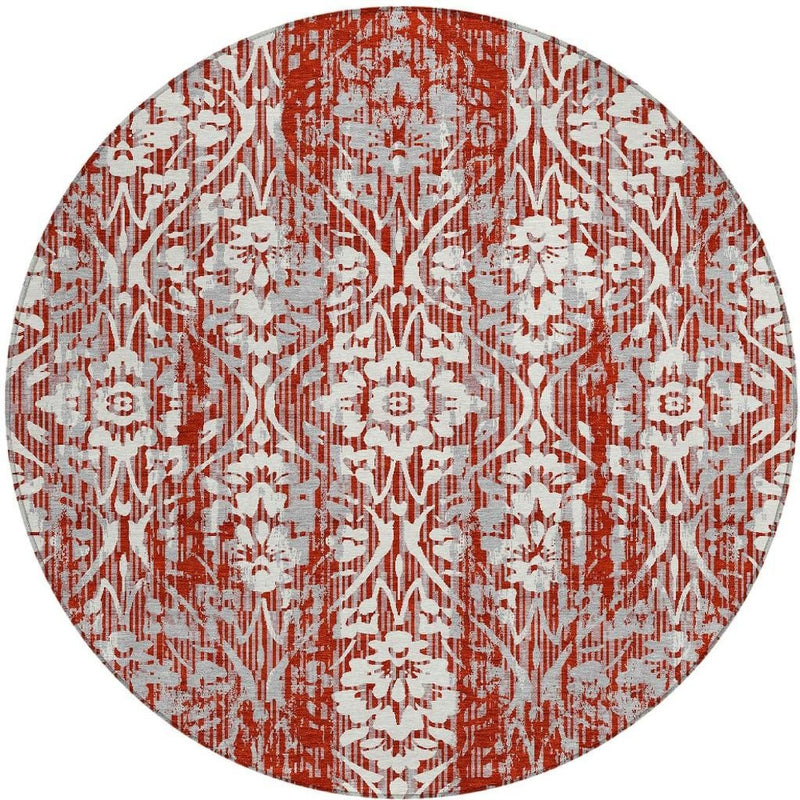 Rust-red round area rug with white damask lattice and distressed print
