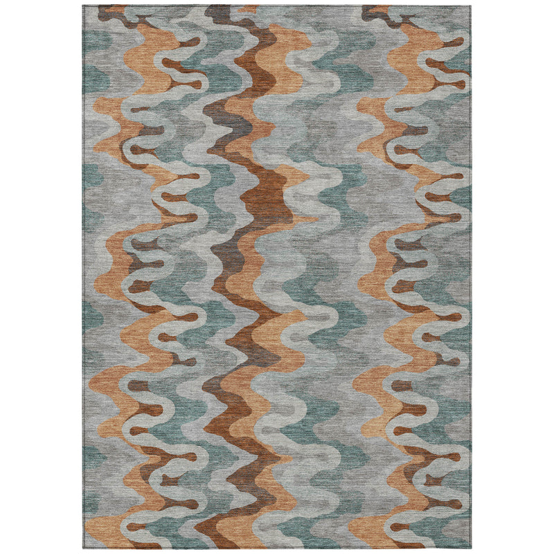 Indoor/outdoor area rug flat-lay with abstract zigzag pattern in silver, copper, and teal